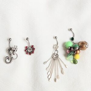 Bundle of 4 belly rings never worn
